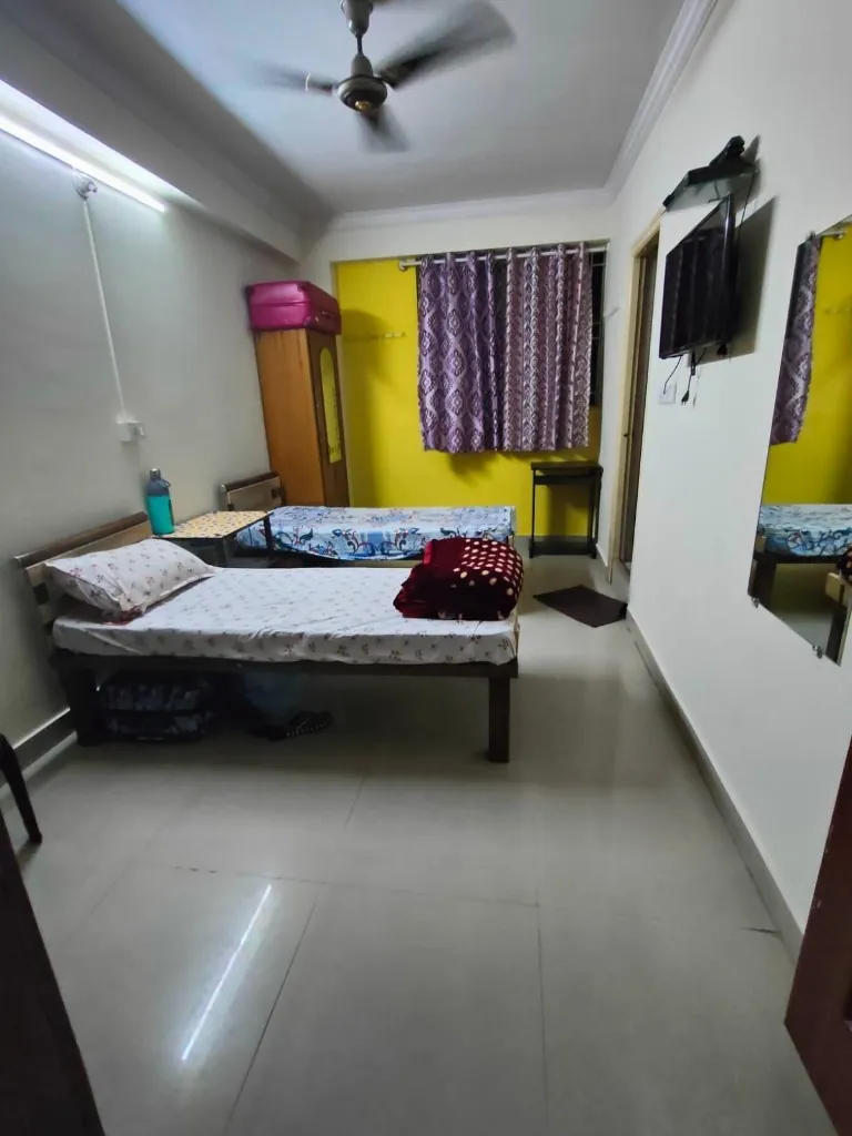Twin-share room with TV at Gayatri Luxury Ladies PG
