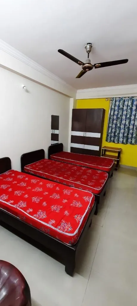 Triple-share room at Gayatri Luxury Ladies PG